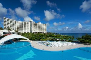 a view of the hotel from the pool at the resort at Renaissance Okinawa Resort in Onna