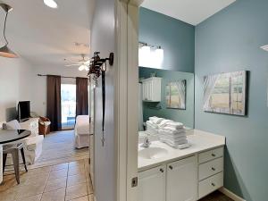 a bathroom with a sink and a room at Inn at Seacrest #206 in Rosemary Beach