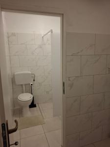 a bathroom with a toilet and a walk in shower at IN Kala in Rijeka +31 photos