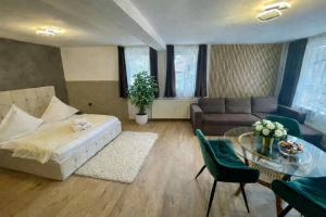a living room with a couch and a table at Pensiunea Carina in Bran