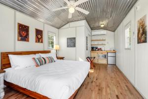 a bedroom with a bed and a ceiling fan at Daybreak Ridge Sunrise Bluff in Blanco