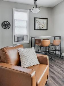 a living room with a couch and a table at Walkerton Sauna Suite in Walkerton