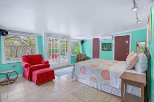 a bedroom with a bed and a chair at Cypress Moon in Wimberley