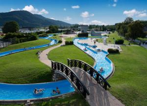 a group of water slides in a park at Apartment by MICHELLE - Terme Čatež House in Čatež ob Savi