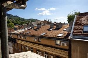 a view of roofs of buildings in a city at Sarajevo Boutique Studios in Sarajevo