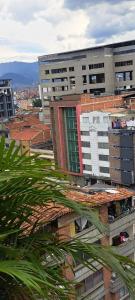 a view of a city with tall buildings at Hotel Via 45 Centro in Medellín
