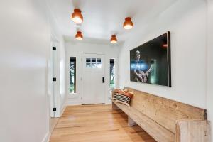 a living room with a bench and a picture on the wall at D2 Farms in Wimberley