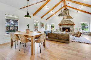 a dining room with a table and a fireplace at D2 Farms in Wimberley