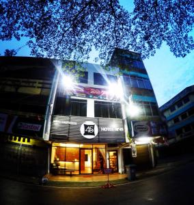 a building with lights on top of it at night at Hotel N45 in Kulai