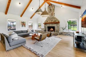 a living room with a couch and a fireplace at D2 Farms in Wimberley +39 photos