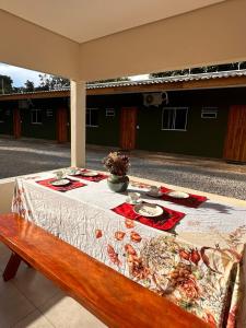 a table with a table cloth on top at Pousada Safari do Jaguar in Poconé +6 photos