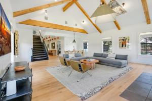a living room with a couch and a table at D2 Farms Main House in Wimberley