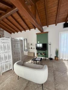 a living room with a couch and a fireplace at La Corte dei Mercanti by Stresahome - Centro Storico in Stresa