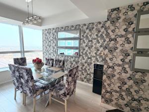 a dining room with a table and chairs at MZK Apartment in Islamabad