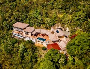 an overhead view of a large house in the woods at A Newly Renovated Luxury 4 Bed Villa in Tortola Island