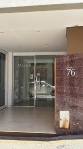an entrance to a building with a glass door at Amoblado Temporal M&S 5 M in Neuquén