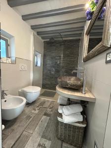 a bathroom with a sink and a toilet at Suite La Corte in Florence