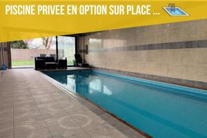 a swimming pool in a building with the words pressure plunge ev option sun place at Private Spa & Zen Atmosphere in Coubron