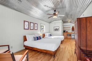 a bedroom with two beds and a ceiling fan at Daybreak Ridge Entire Property in Blanco