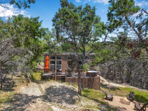 a house on a hill with trees at Martha at the Bend in Wimberley