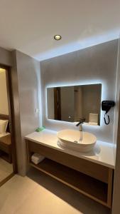 a bathroom with a sink and a mirror at Shams Boutique Hotel in Bukhara +51 photos