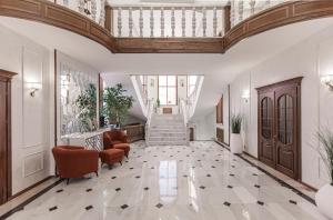 an image of a lobby with a ceiling at Ermensai Wellness Boutique Hotel in Almaty