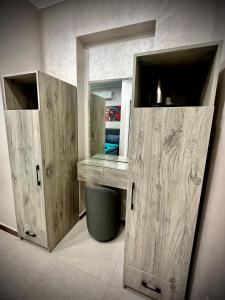 a dressing room with wooden cabinets and a mirror at Heritage Hostel Cairo in Cairo +66 photos