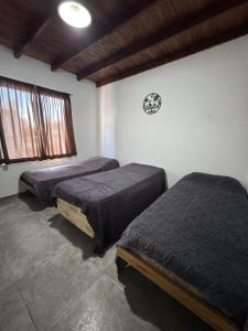 a room with two beds in a room at Complejo del Mar in Santa Clara del Mar
