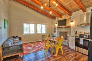 a kitchen and living room with a table and chairs at Millies Cottages Unit 3 - Phyllis in Canyon Lake