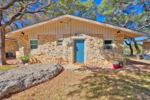 a stone house with a blue door at Millies Cottages Unit 3 - Phyllis in Canyon Lake