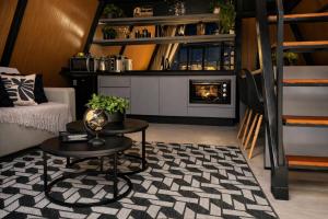 a living room with a table and a fireplace at Cabana Industrial in Palhoça