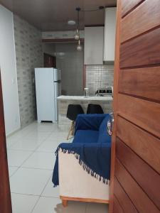 a kitchen with a door leading to a kitchen with a counter at Bem Estar no Bom Ap 2 in Arapiraca +2 photos