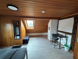a room with a bed and a table and a window at Good N8 Apartment in Wabern