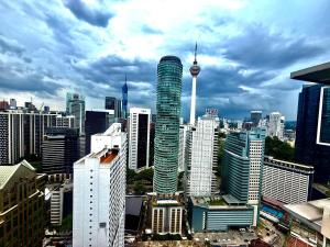 a view of a large city with tall buildings at Parkview Suites Near By Klcc in Kuala Lumpur