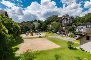 an image of a park with a playground at 2-suite apartment just a few meters from Rua Coberta. in Gramado