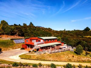 an aerial view of a house on a hill at Omori Lodge in Tokaanu