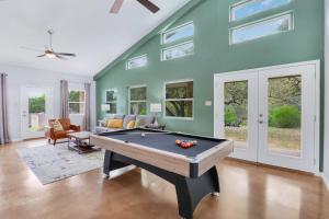 a living room with a pool table in it at Artista in Wimberley
