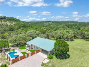 an aerial view of a house with a swimming pool at Artista in Wimberley +62 photos