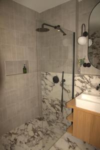 a bathroom with a shower and a sink at Rezidence Jakubská in Brno