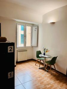 a small room with a table and chairs in it at Beauty Holidays in Rome