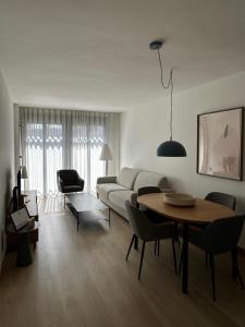 a living room with a couch and a table at AT home Santo Domingo in Guadalajara