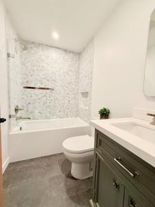 a bathroom with a toilet and a tub and a sink at Private Hillside 2BR Suite Near Town in Ojai +16 photos