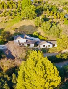 an aerial view of a house on a hill with trees at Private Hillside 2BR Suite Near Town in Ojai