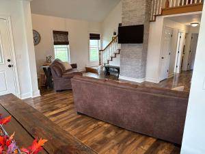 a living room with a couch and a fireplace at Potter Cottage - Beautiful Serene Setting in Ferdinand