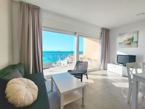 a living room with a view of the ocean at Villa Ilenia in Murter