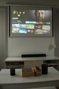 a flat screen tv hanging on a wall at Casa Calera in Nerja +2 photos