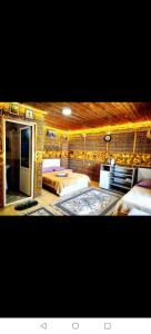 a bedroom with two beds and a brick wall at Baku "ISR" Guest House in Sǝnqǝçal Stansiyası +81 photos