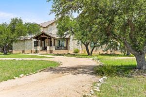 a dirt road in front of a house at Big Red Chicken Estate in Wimberley