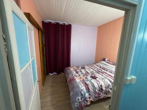 a small room with a bed and a window at Gite la fontaine dargent in Aisy-sur-Armançon