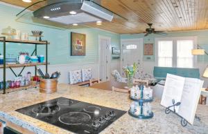 a kitchen with a counter top with a stove top at Bungalows on the Square- Unit 1 in Wimberley